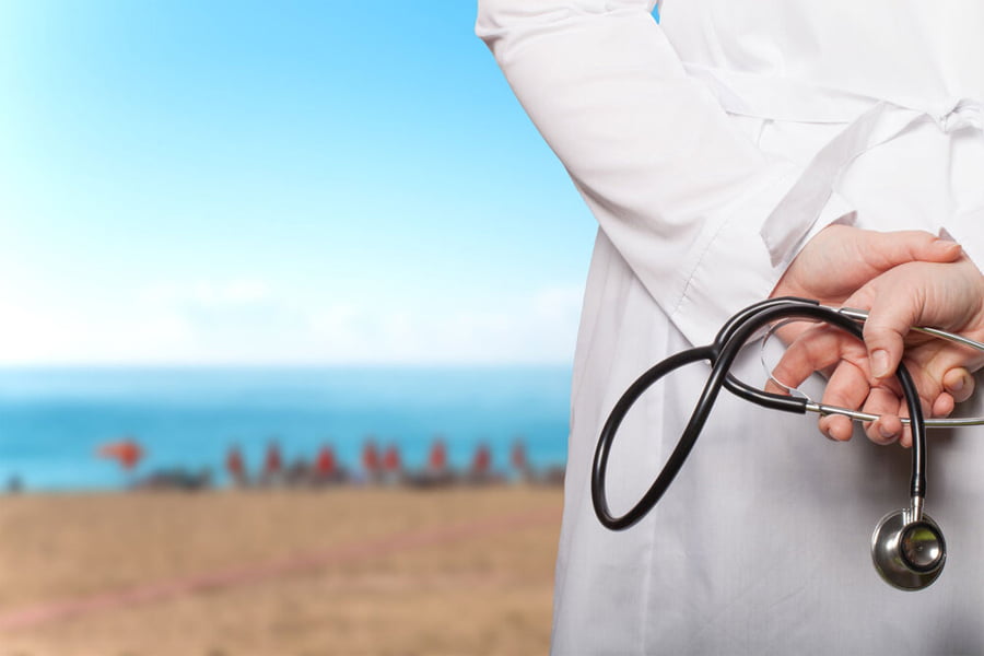 How is the student health insurance policy in Caribbean Medical schools?